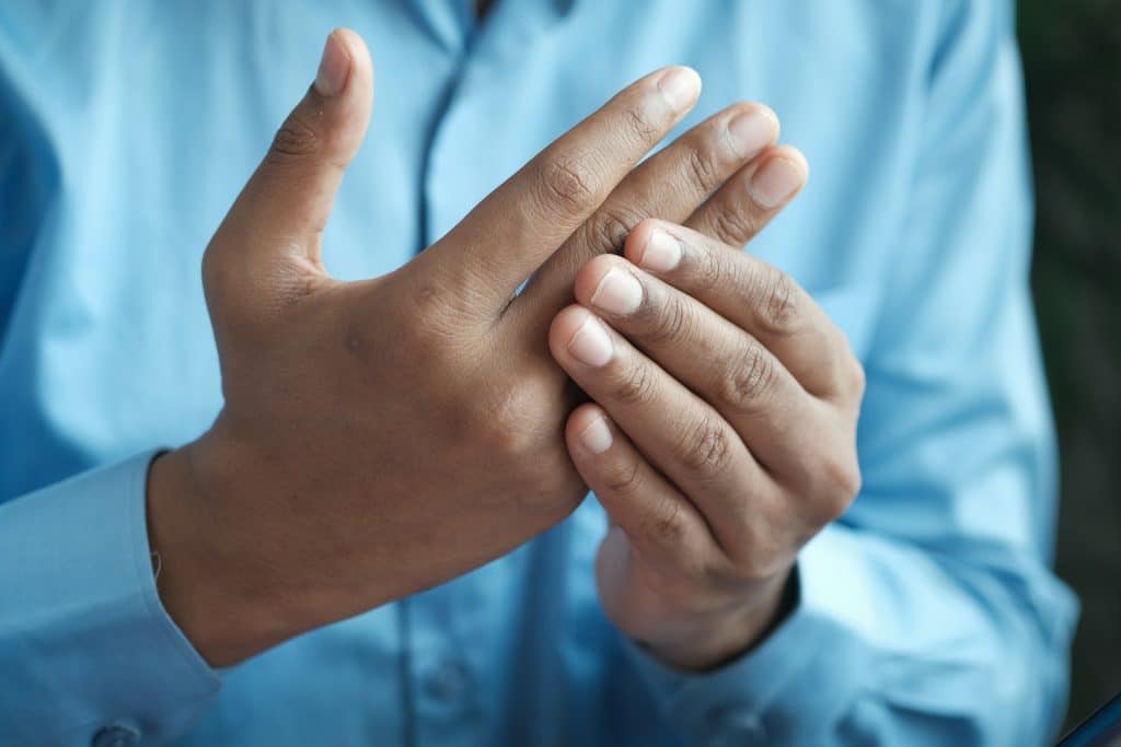 patient with arthritic pain in hands